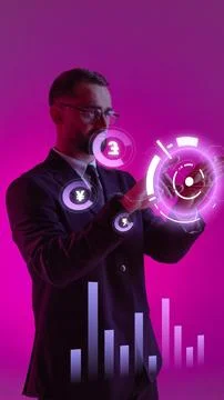 Businessman in a suit using futuristic interface with glowing finance symbols on Stock Photos