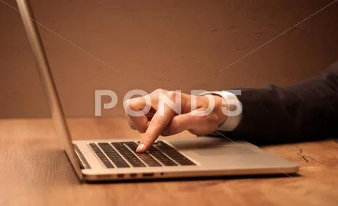 Businessman is suit working on laptop Stock Photos