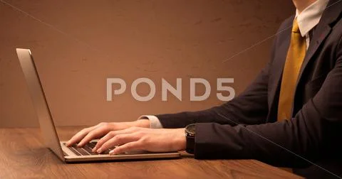Businessman is suit working on laptop Stock Photos