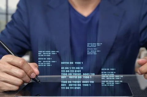 Businessman in Suit Writing Code on Tablet with Binary Numbers Stock Photos