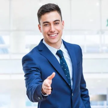 Businessman in suite reaching out hand. Foto stock