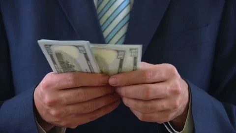 Businessman in Suits Counting Bunch of USD Dollar Money Stock Footage 76514919