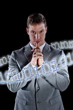 Businessman surrounded by ring of binary code Stockfoto's