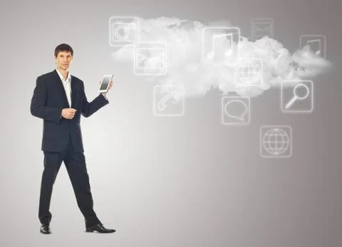 Businessman with tablet and the cloud with applications icons on grey Illustrazione stock