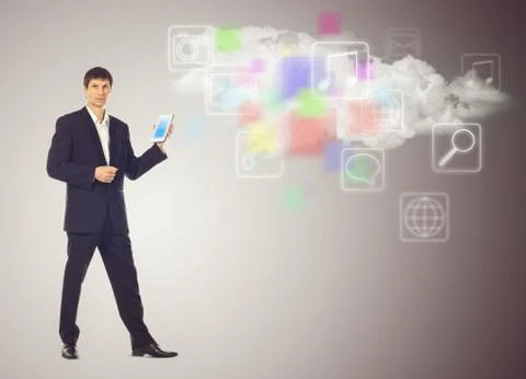 Businessman with tablet and the cloud with applications icons Illustrazione stock