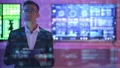 The businessman with a tablet standing on displays background 4k or 4k+ Resolution
