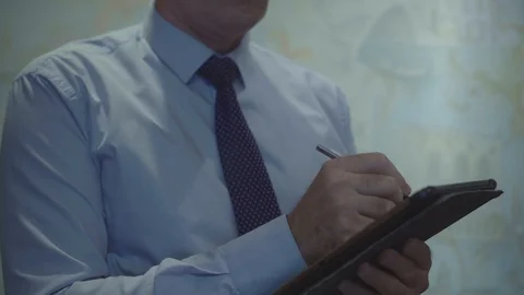 Businessman takes notes Video stock 112078321