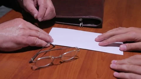 Businessman takes out a document and sings it 2 Stock-Footage 322066473
