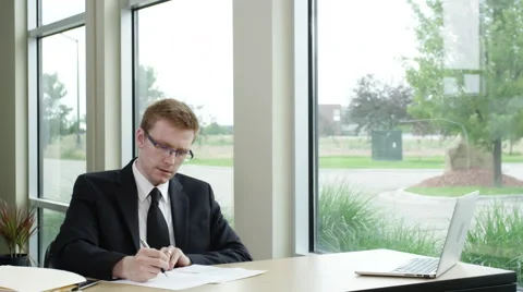 Businessman taking notes and studying Video stock 67364559