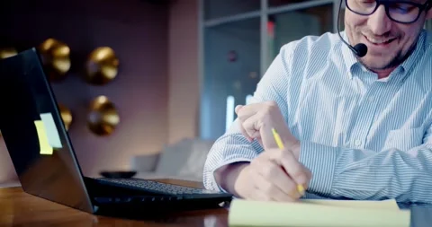 Businessman Taking Notes During Office Call Meeting 스톡 동영상 323680498