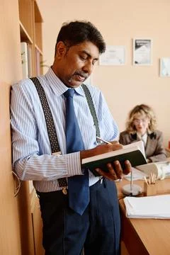 Businessman Taking Notes During Office Meeting Stock Photos