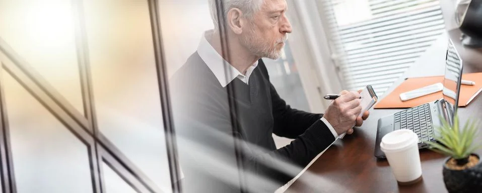 Businessman taking notes on notebook; multiple exposure 스톡 사진