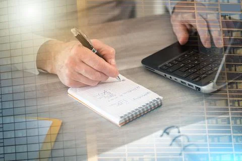 Businessman taking notes on notebook; multiple exposure Stock Photos
