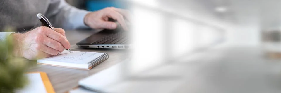 Businessman taking notes on notebook; panoramic banner Stock Photos