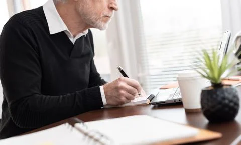 Businessman taking notes on notebook Stock Photos