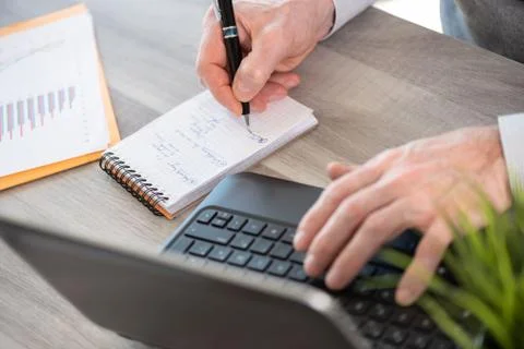 Businessman taking notes on notebook 스톡 사진