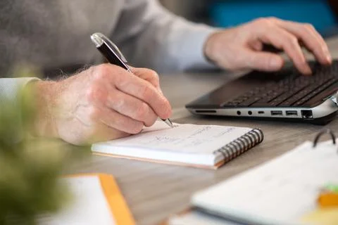 Businessman taking notes on notebook Stock Photos