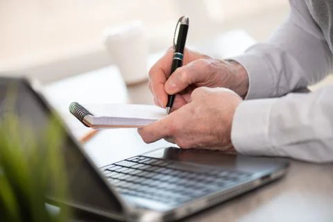 Businessman taking notes on notebook Stock Photos
