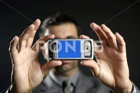 Businessman taking photos, mobile camera Stock Photos