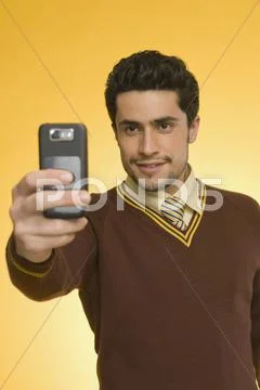 Businessman taking a picture from a mobile phone Stock Photos