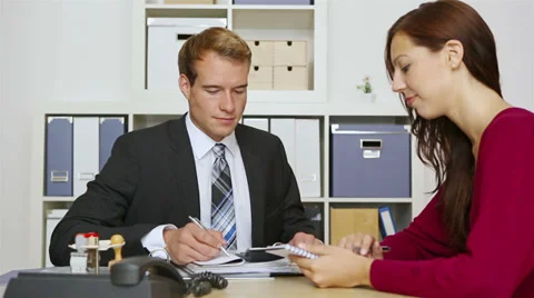 Businessman talking to client in meeting Stock Footage 32232123