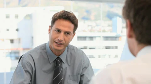 Businessman talking with a customer Stock Footage