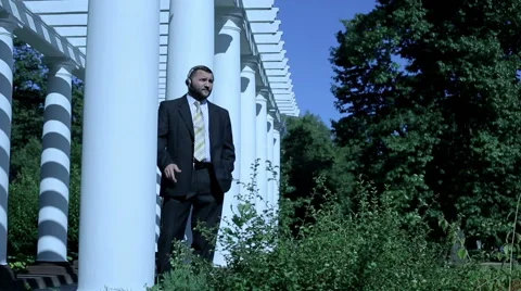 Businessman talking by headphones  Stock Footage 59088334