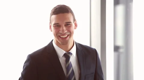 Businessman talking with his colleagues after presentation Stock Footage 59541953