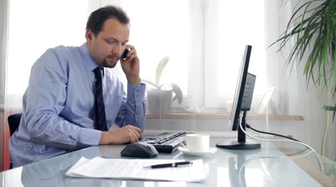Businessman talking on mobile phone Stock Footage