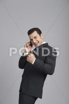 Businessman talking on a mobile phone Stock Photos