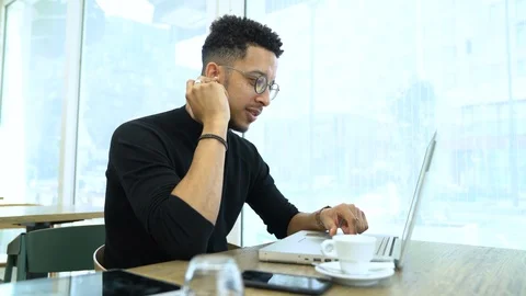 Businessman talking on the phone and using laptop Stock Footage 106299744