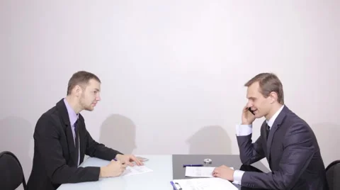 Businessman talking on the phone. colleague tells lyrics. Negotiation Stock Footage 59587301