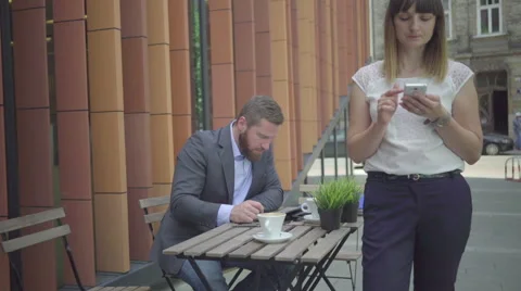 Businessman is talking by phone during work with tablet. Outdoor. Steadicam shot Vidéo 65333550