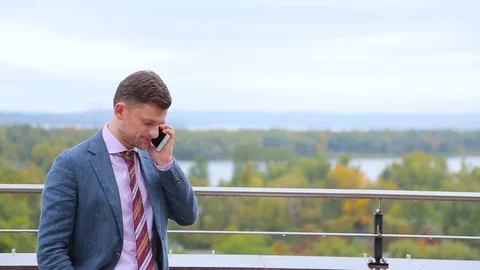 Businessman talking on a phone Stock Footage 75192877