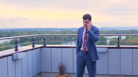 Businessman talking on a phone Stock Footage 75194092