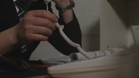 Businessman Talking on Phone While Typing at Office Desk Vidéo 334711740