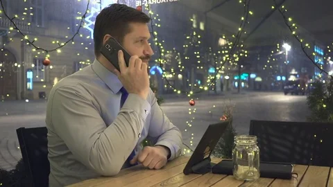 Businessman talking by smartphone, check data in tablet, cafe, evening Vidéo 72999180