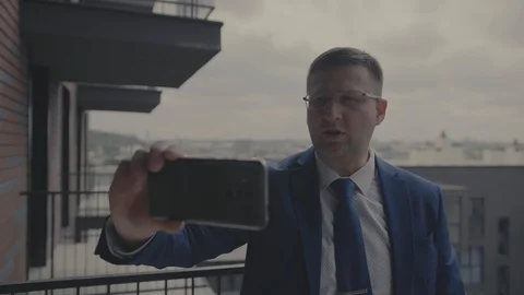 Businessman talking on a smartphone Stock Footage 129849012