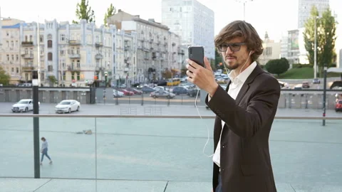 Businessman talking on video chat using smartphone Stock Footage 114056678
