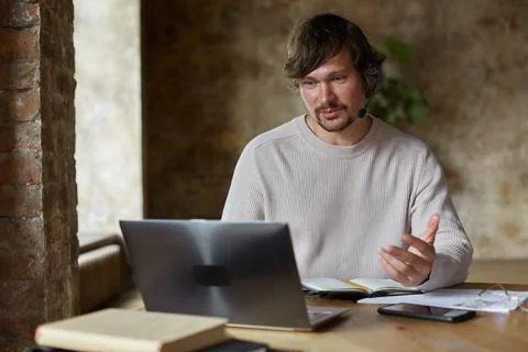 Businessman talking to web camera during remote online distance video call. Stock Photos
