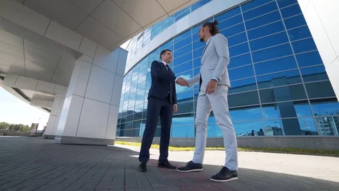 Businessman talks to partner on future construction Stock Footage 77584977