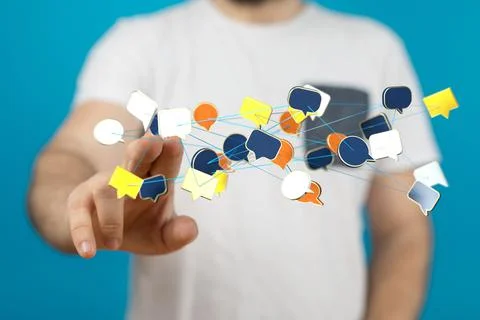 Businessman tapping on a digital render of a network of colorful speech bubble i Stock Photos