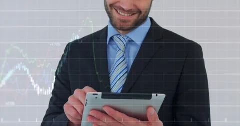 Businessman tapping tablet and displaying animated financial line charts while Stock Footage 318240266