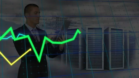 Businessman tapping tablet in data center, generating holographic trend lines Stock Footage 310317988