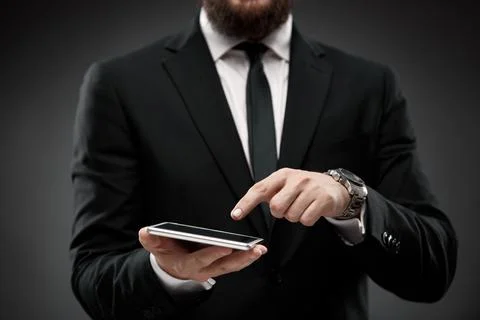 Businessman tapping on a tablet screen Stock Photos