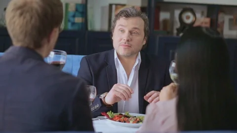 Businessman telling collegues ideas looking at them. Stock Footage 130053953