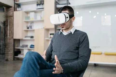 Businessman testing virtual reality headset for games Foto stock