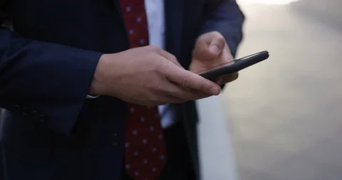 Businessman texting on a iPhone Stock Footage 107607410