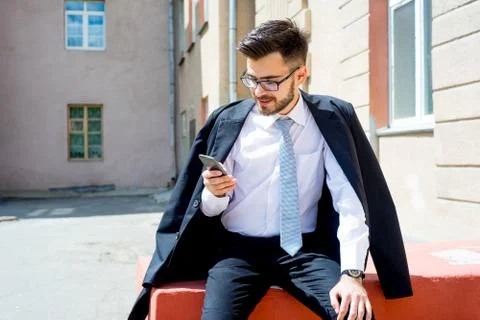 Businessman is texting Stock Photos