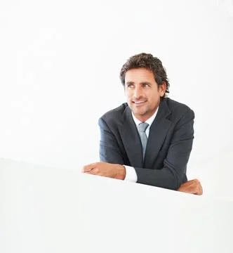 Businessman, thinking and lean on wall with happy or smile with pride for Stock Photos